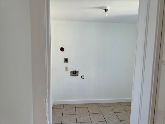 clothes washing area with washer hookup, hookup for an electric dryer, and light tile patterned floors