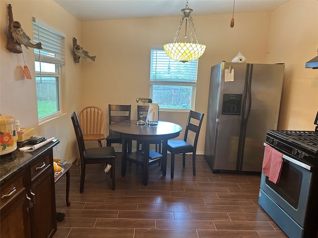 dining space featuring dark wood-type flooring