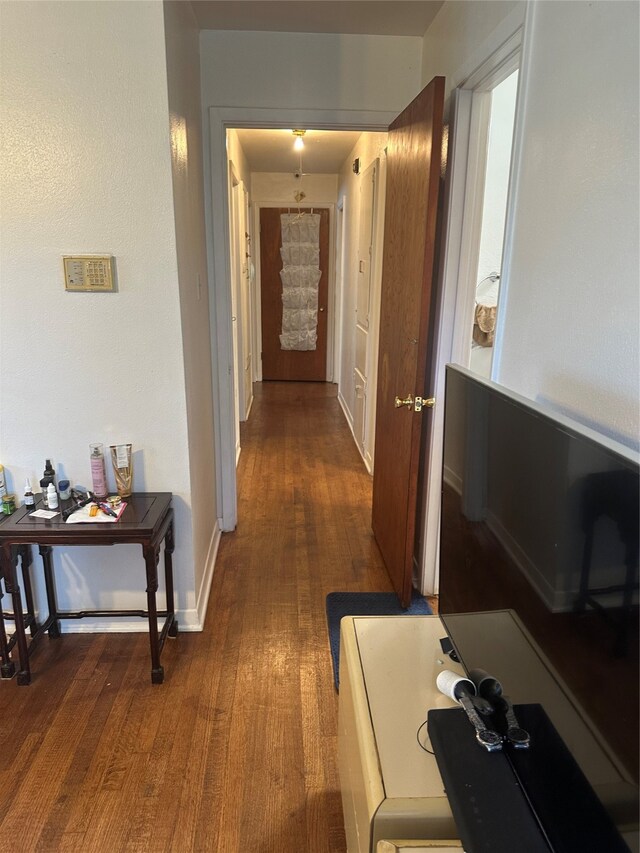 hallway featuring dark hardwood / wood-style flooring