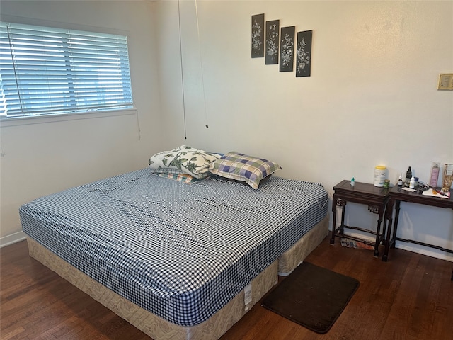 bedroom featuring dark wood-type flooring