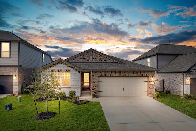 view of front facade featuring a lawn and a garage