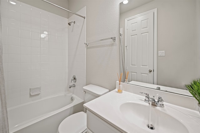 full bathroom featuring shower / bath combo, vanity, and toilet