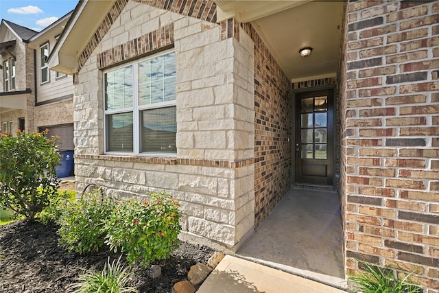 entrance to property featuring a garage