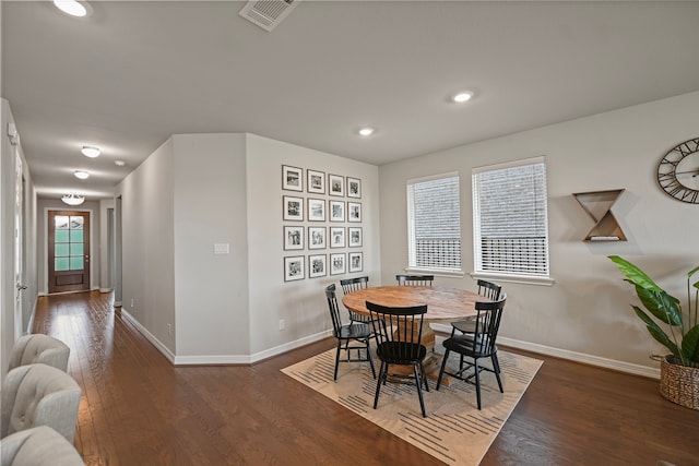 dining space featuring dark hardwood / wood-style floors