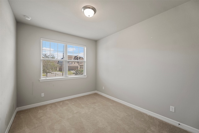 empty room with light colored carpet