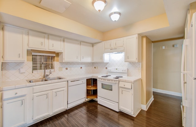 kitchen featuring white cabinets, dark hardwood / wood-style floors, sink, and white appliances