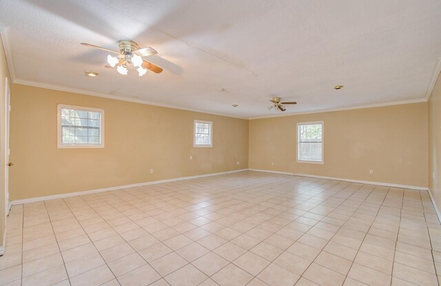 unfurnished room featuring ceiling fan, a textured ceiling, crown molding, and light tile patterned floors