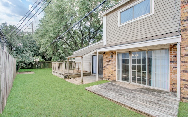 view of yard featuring a wooden deck