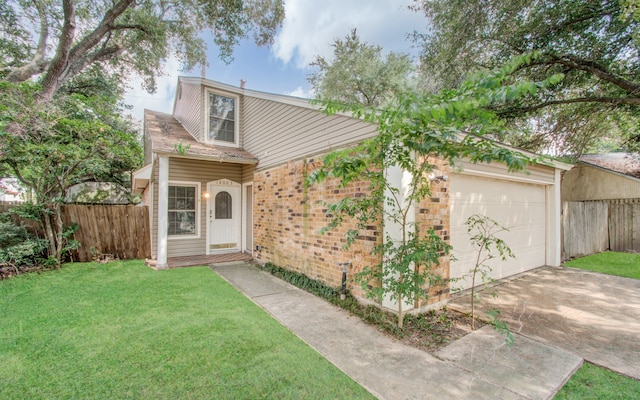 exterior space featuring a front lawn and a garage