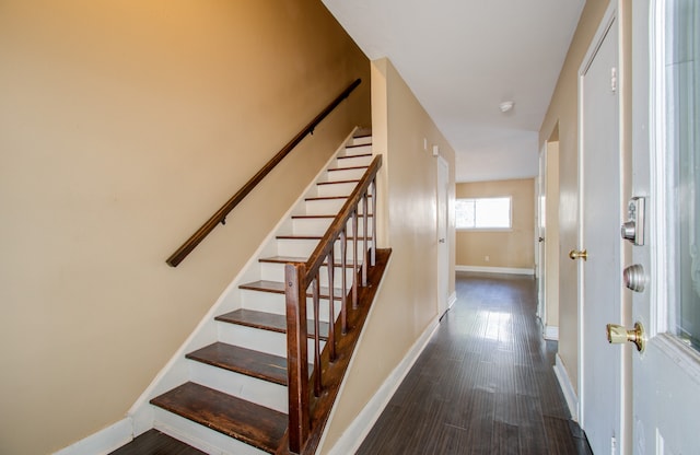 stairs with hardwood / wood-style flooring