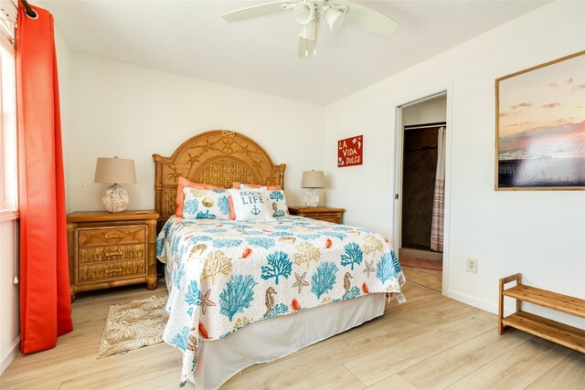 bedroom featuring light wood-type flooring and ceiling fan