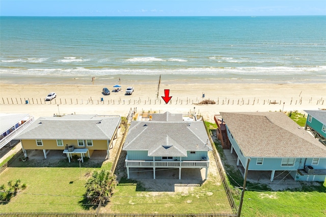 bird's eye view with a water view and a view of the beach