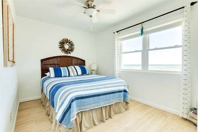 bedroom with ceiling fan and light hardwood / wood-style flooring