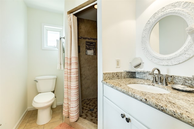 bathroom with walk in shower, vanity, toilet, and tile patterned floors