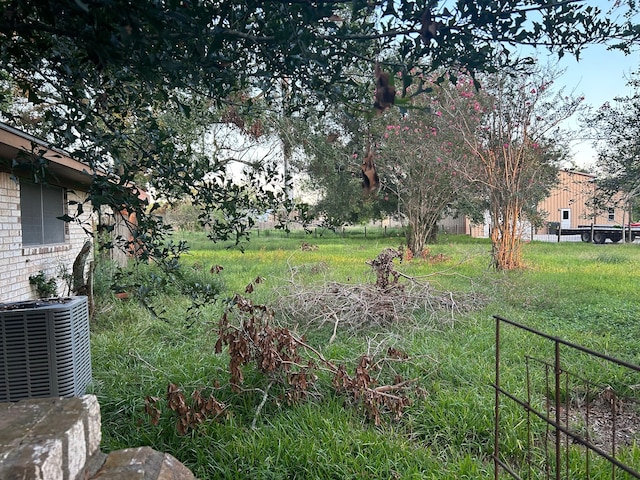 view of yard with central air condition unit