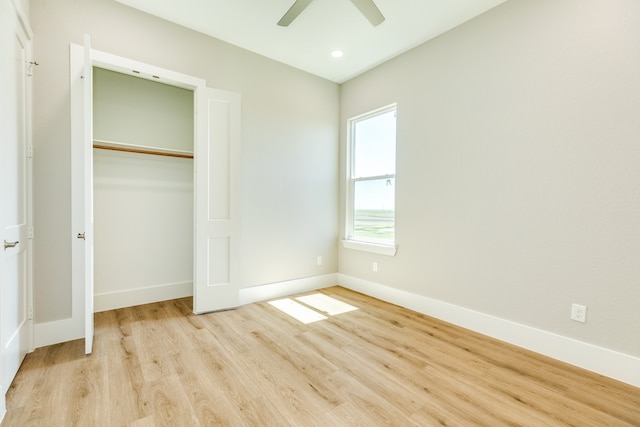 unfurnished bedroom featuring a closet, ceiling fan, and light hardwood / wood-style flooring