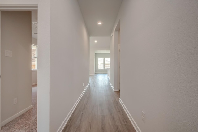 910 Rosewood Trl, Beasley, TX 77417 - hall featuring baseboards, wood finished floors, and recessed lighting