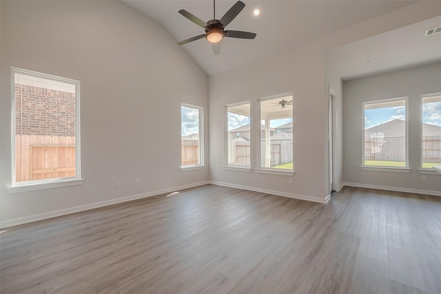 910 Rosewood Trl, Beasley, TX 77417 - empty room featuring a ceiling fan, high vaulted ceiling, and wood finished floors
