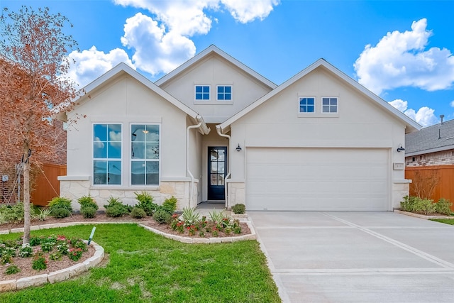 910 Rosewood Trl, Beasley, TX 77417 - view of front facade with concrete driveway, stucco siding, fence, an attached garage, and stone siding