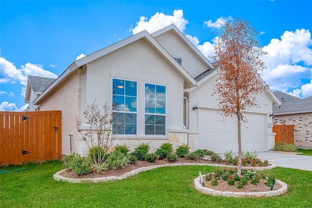 910 Rosewood Trl, Beasley, TX 77417 - view of front of property featuring a shingled roof, driveway, stucco siding, and an attached garage