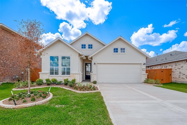 910 Rosewood Trl, Beasley, TX 77417 - view of front of house featuring driveway, a front yard, stucco siding, fence, and a garage