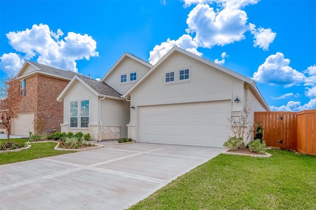 910 Rosewood Trl, Beasley, TX 77417 - view of front facade with a gate, fence, concrete driveway, a front yard, and stucco siding