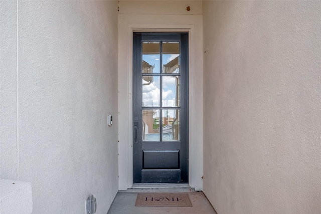 910 Rosewood Trl, Beasley, TX 77417 - doorway to property with stucco siding