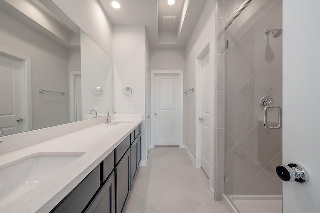 910 Rosewood Trl, Beasley, TX 77417 - full bathroom with a stall shower, double vanity, visible vents, and a sink