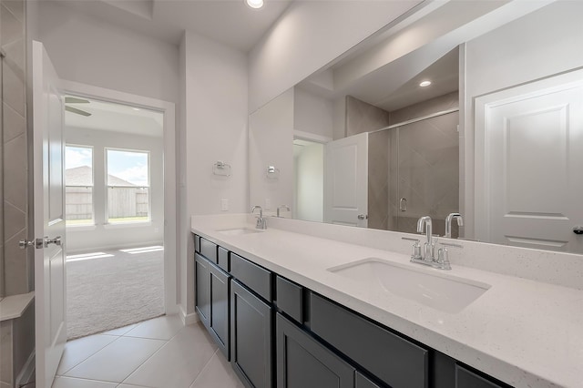 910 Rosewood Trl, Beasley, TX 77417 - bathroom with double vanity, a sink, a stall shower, and tile patterned floors