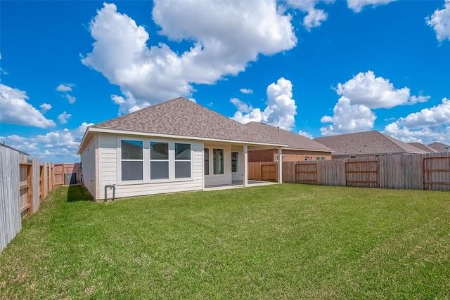 910 Rosewood Trl, Beasley, TX 77417 - back of house with a patio, a fenced backyard, roof with shingles, and a yard