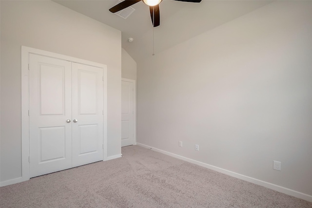 910 Rosewood Trl, Beasley, TX 77417 - unfurnished bedroom with vaulted ceiling, carpet, baseboards, visible vents, and a closet