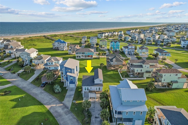 aerial view featuring a water view and a view of the beach