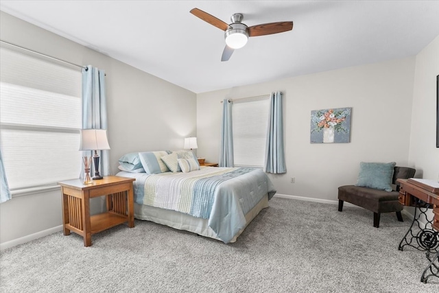 bedroom with ceiling fan and light colored carpet