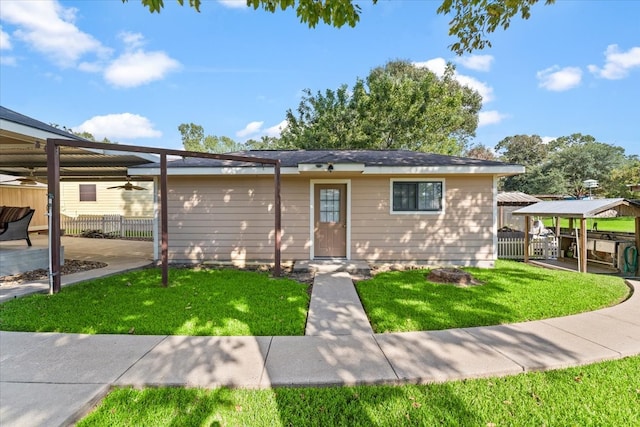 view of front of property with a front lawn and a gazebo