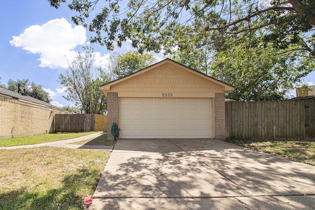 garage featuring a lawn