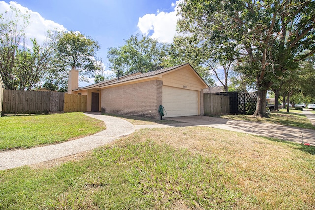 view of property exterior featuring a garage and a yard