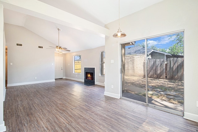 unfurnished dining area with lofted ceiling, ceiling fan, and dark hardwood / wood-style floors