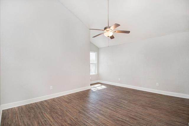 empty room featuring ceiling fan, vaulted ceiling, and dark hardwood / wood-style flooring