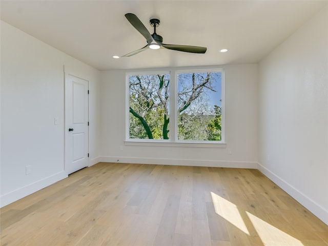 empty room featuring light hardwood / wood-style flooring and ceiling fan