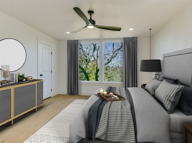 bedroom featuring ceiling fan and light hardwood / wood-style flooring