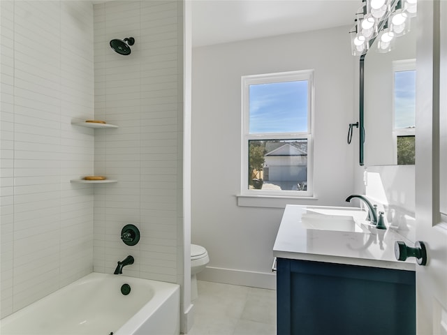 full bathroom with tile patterned flooring, tiled shower / bath combo, vanity, and toilet