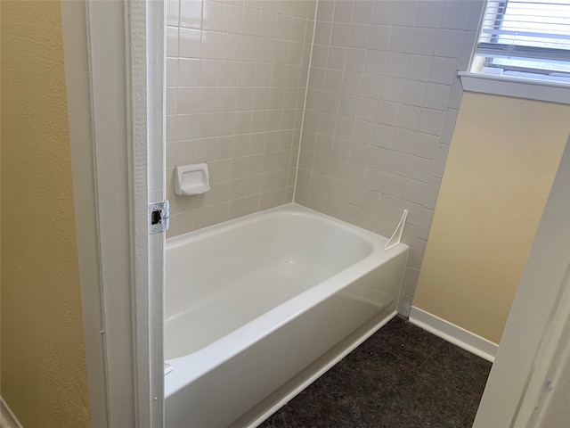 bathroom with a tub to relax in