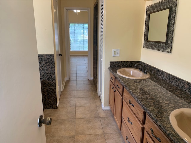 bathroom with tile patterned flooring and vanity