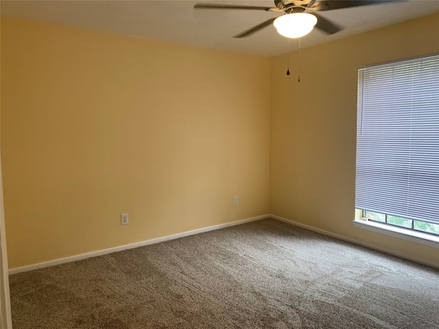 carpeted empty room with ceiling fan