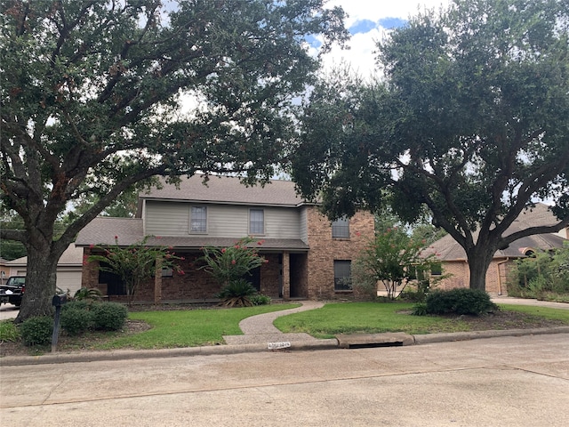 view of property featuring a front yard