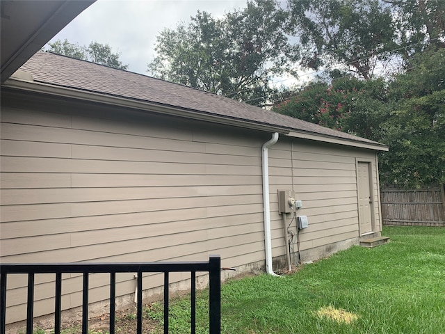 view of side of property with a yard