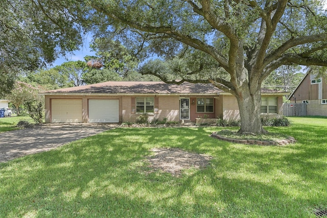 ranch-style home with a front lawn and a garage