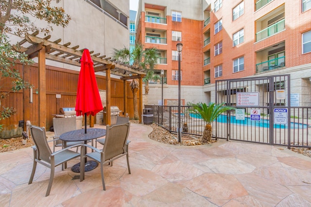 view of patio / terrace featuring a balcony and a pergola