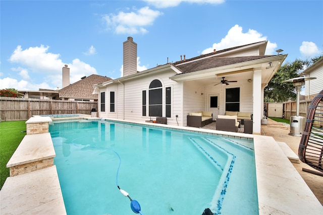 view of pool with an outdoor living space, ceiling fan, and a patio area