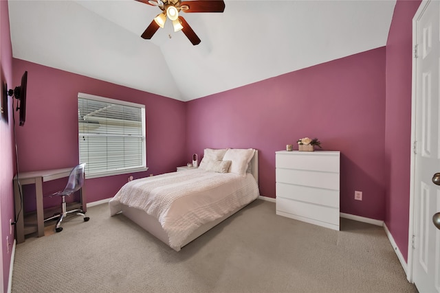 bedroom with ceiling fan, light colored carpet, and vaulted ceiling